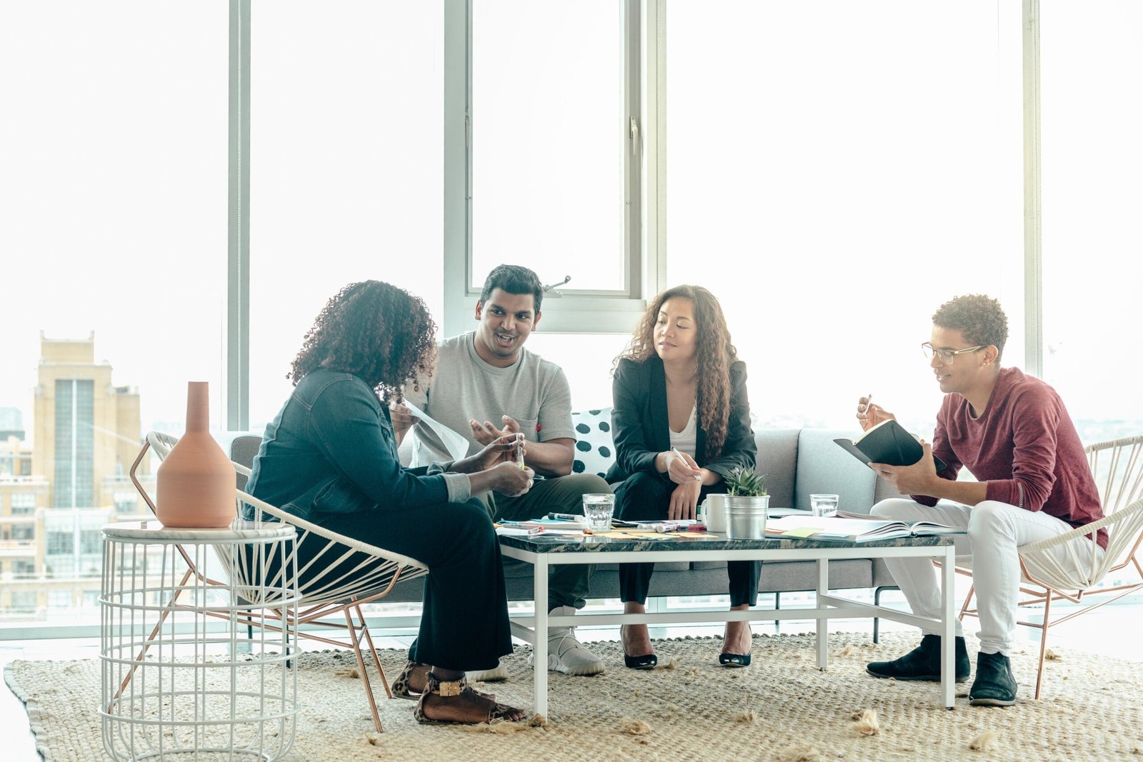 team-brainstorm-meeting-in-bright-sunny-office